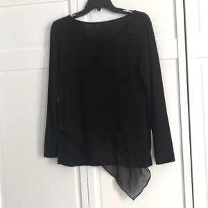 Black top with pretty Asymmetric detail on bottom hem.